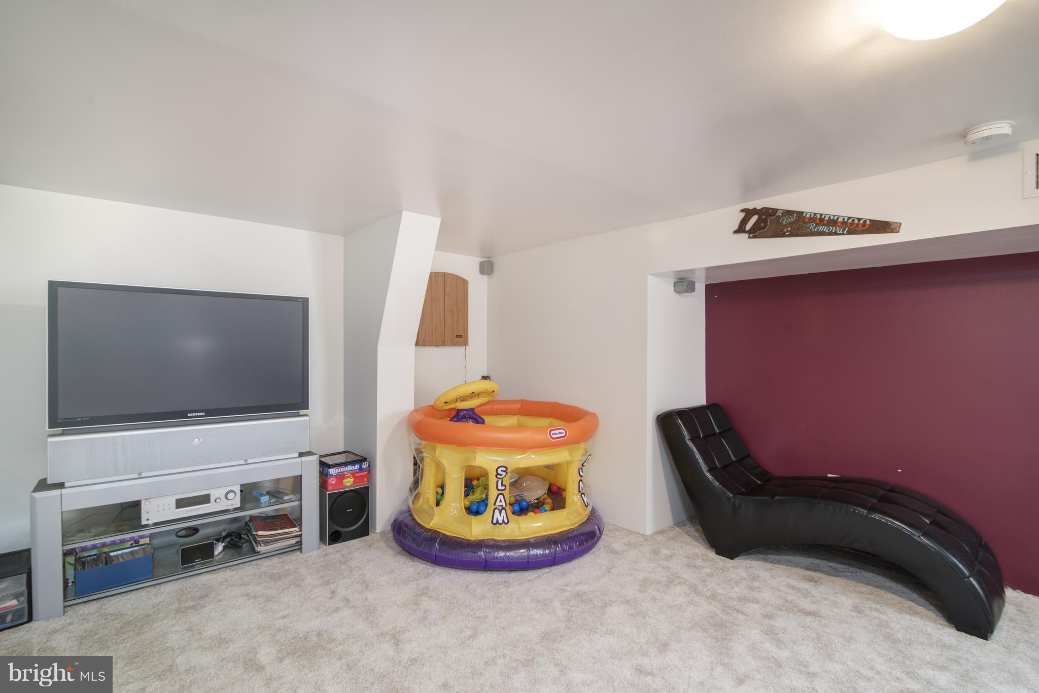 11306 Sword Road Williamsport, MD 21795 - Photo 20 of 30 a room with furniture and a flat screen tv