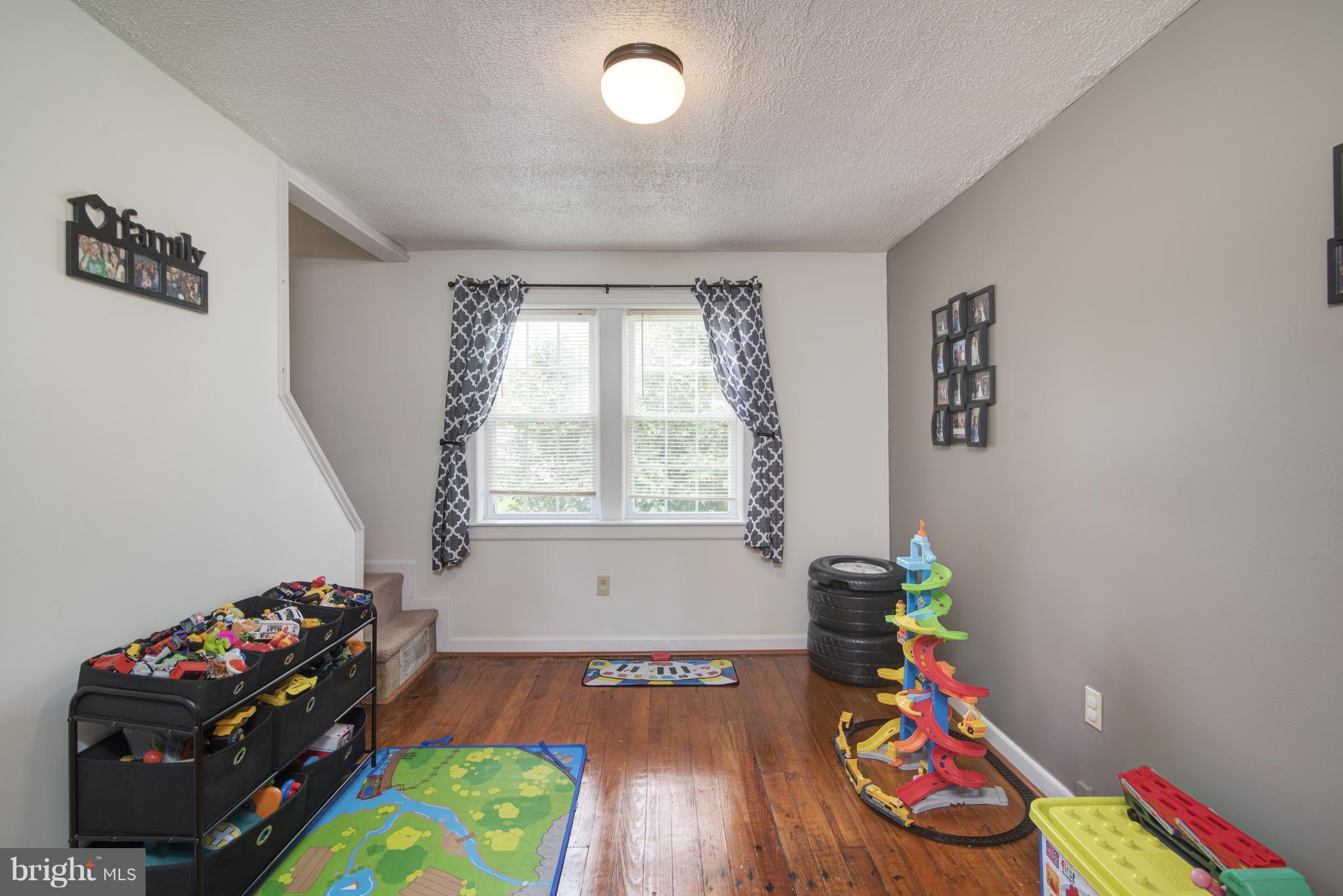 11306 Sword Road Williamsport, MD 21795 - Photo 21 of 30 a room with toys and a wooden floor