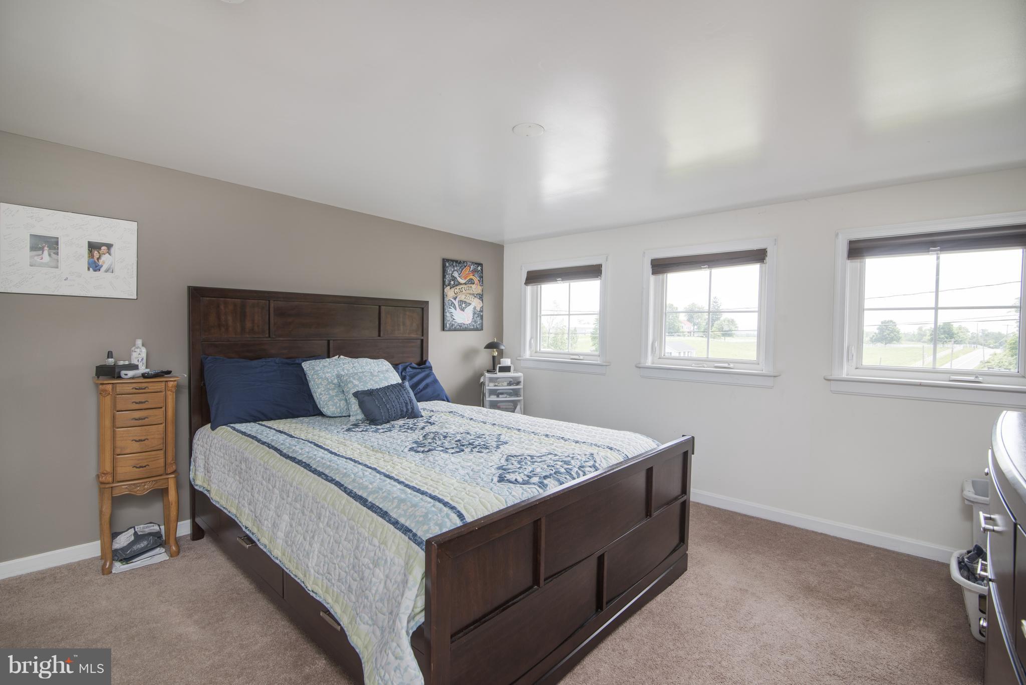 11306 Sword Road Williamsport, MD 21795 - Photo 25 of 30 a bed sitting in a bedroom next to a window