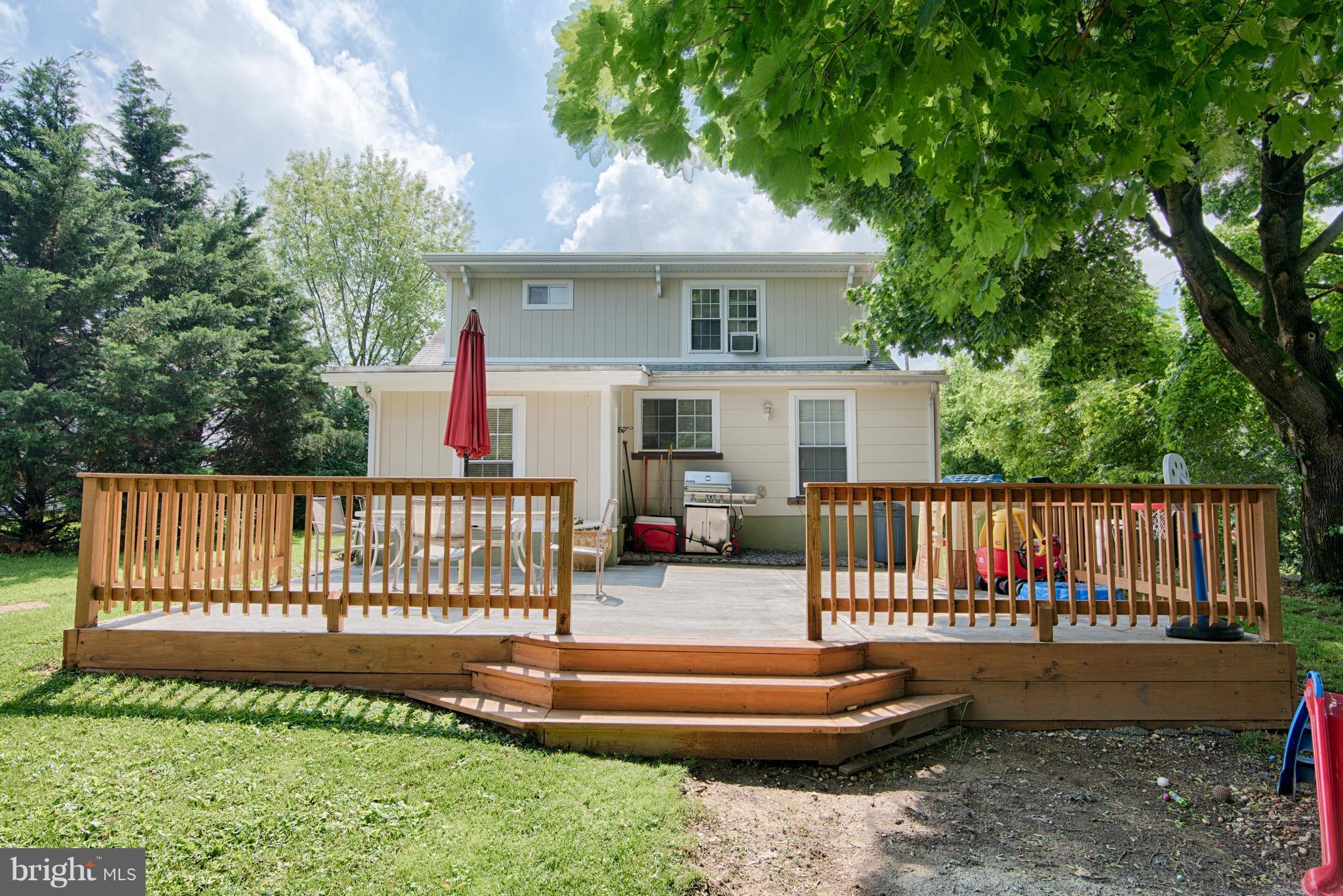 11306 Sword Road Williamsport, MD 21795 - Photo 28 of 30 a view of a house with wooden deck and a yard