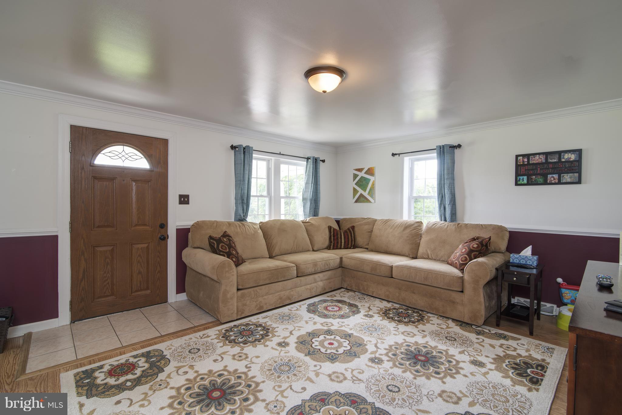 11306 Sword Road Williamsport, MD 21795 - Photo 5 of 30 a living room with furniture and a rug