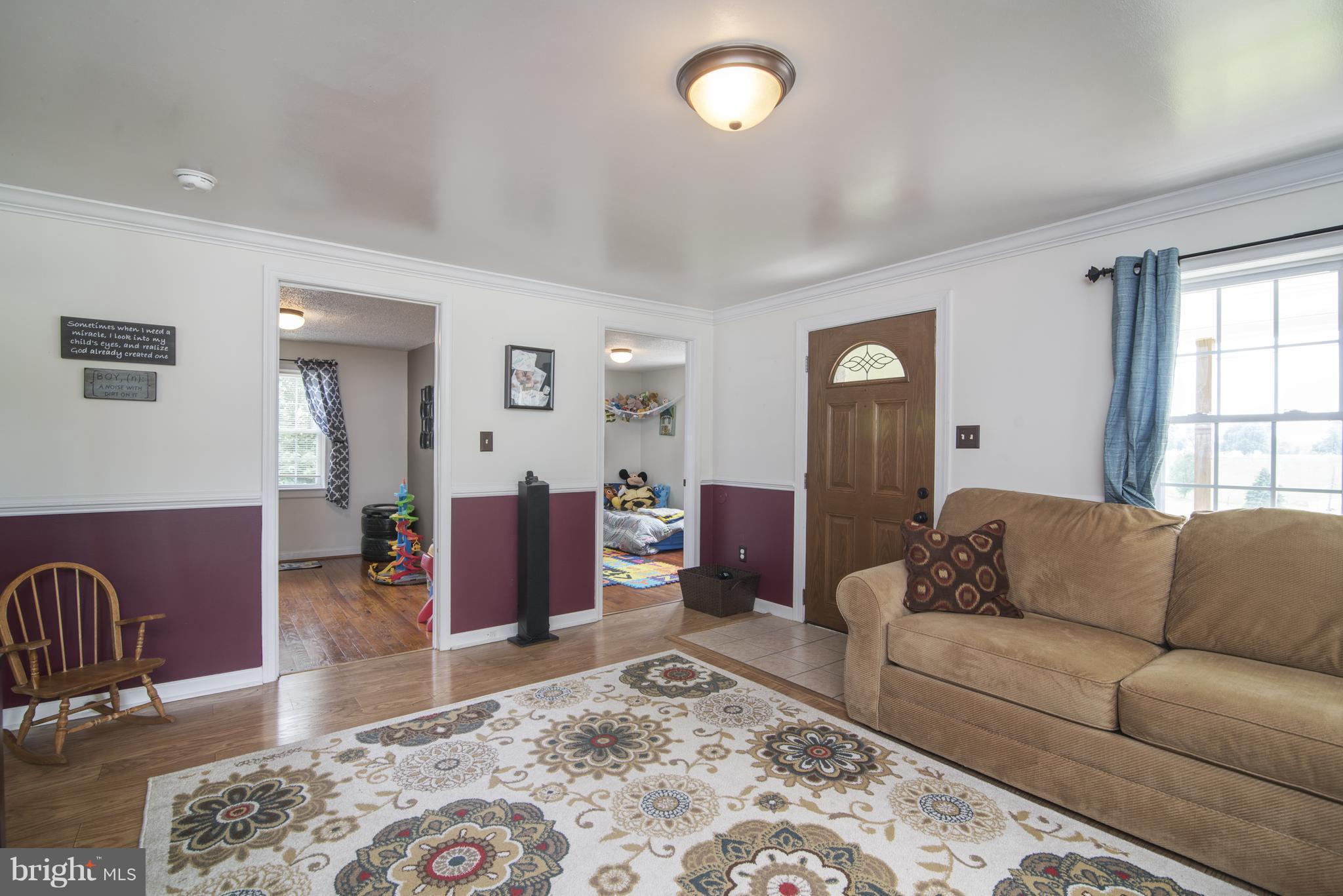 11306 Sword Road Williamsport, MD 21795 - Photo 6 of 30 a living room with furniture and wooden floor