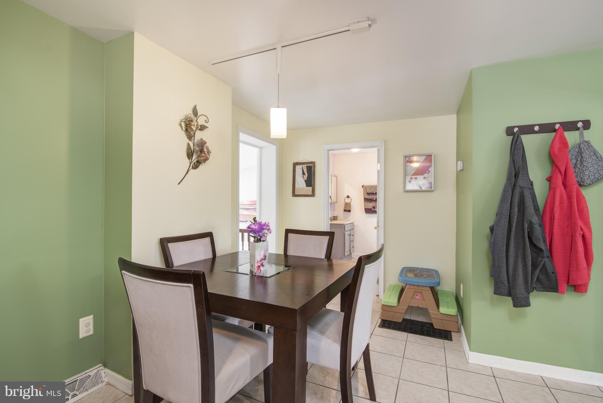 11306 Sword Road Williamsport, MD 21795 - Photo 9 of 30 a view of a dining room with furniture and a potted plant