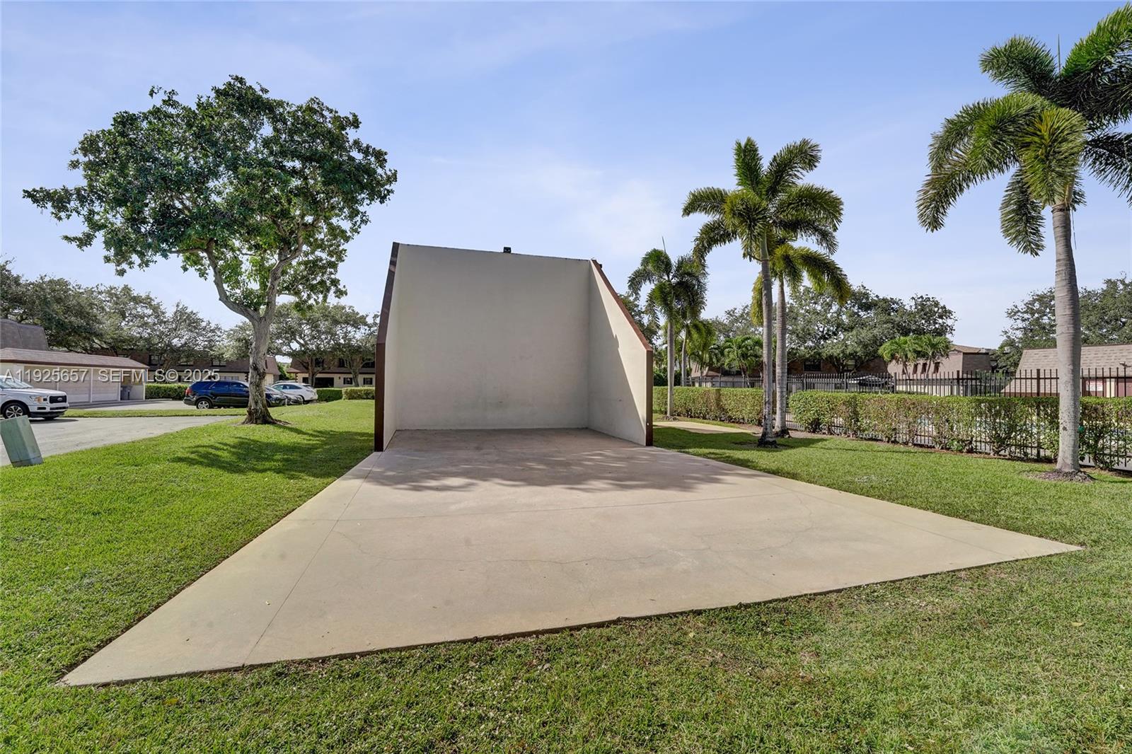 9340 Southwest 61st Way, Unit B Boca Raton, FL 33428 - Photo 23 of 25 a view of a yard with palm trees