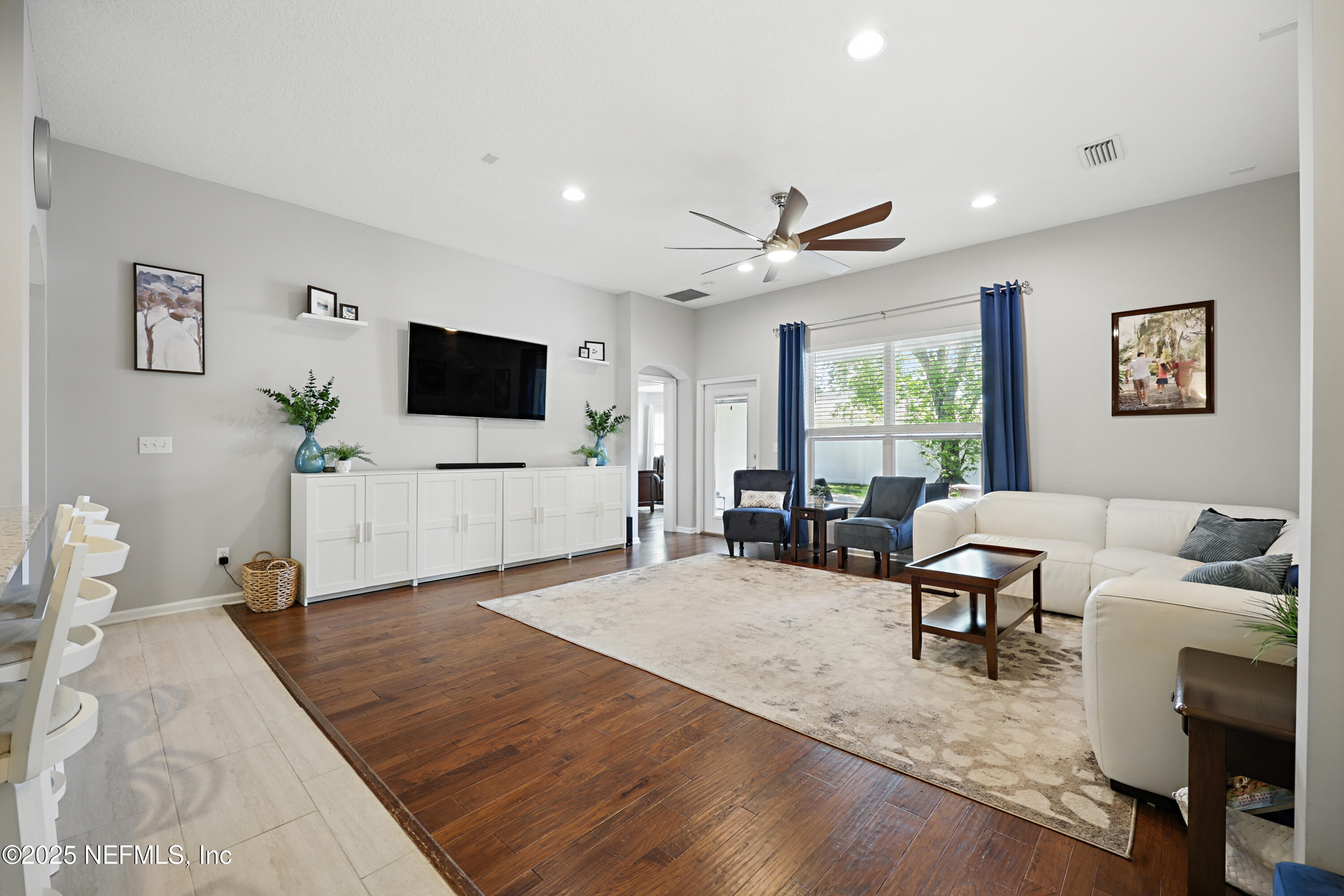 672 Porta Rosa Circle St. Augustine, FL 32092 - Photo 12 of 42 a living room with furniture and a flat screen tv