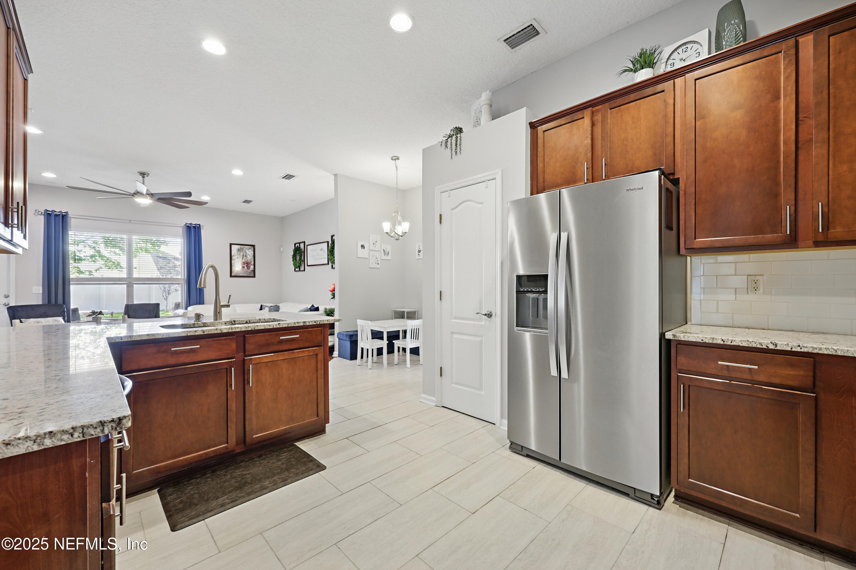 672 Porta Rosa Circle St. Augustine, FL 32092 - Photo 16 of 42 a kitchen with stainless steel appliances granite countertop a refrigerator a oven a sink and dishwasher