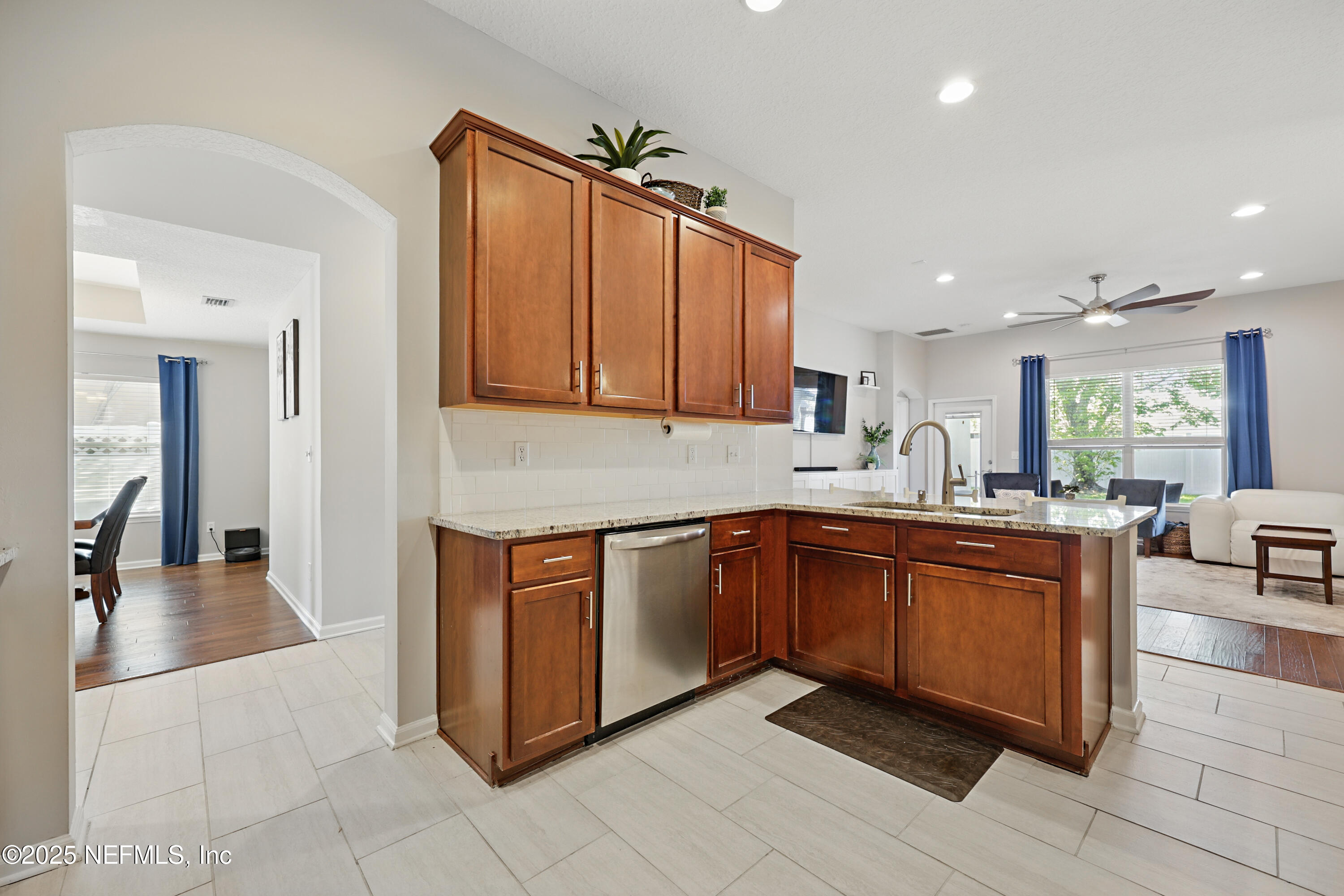 672 Porta Rosa Circle St. Augustine, FL 32092 - Photo 17 of 42 a kitchen with stainless steel appliances granite countertop a sink and cabinets