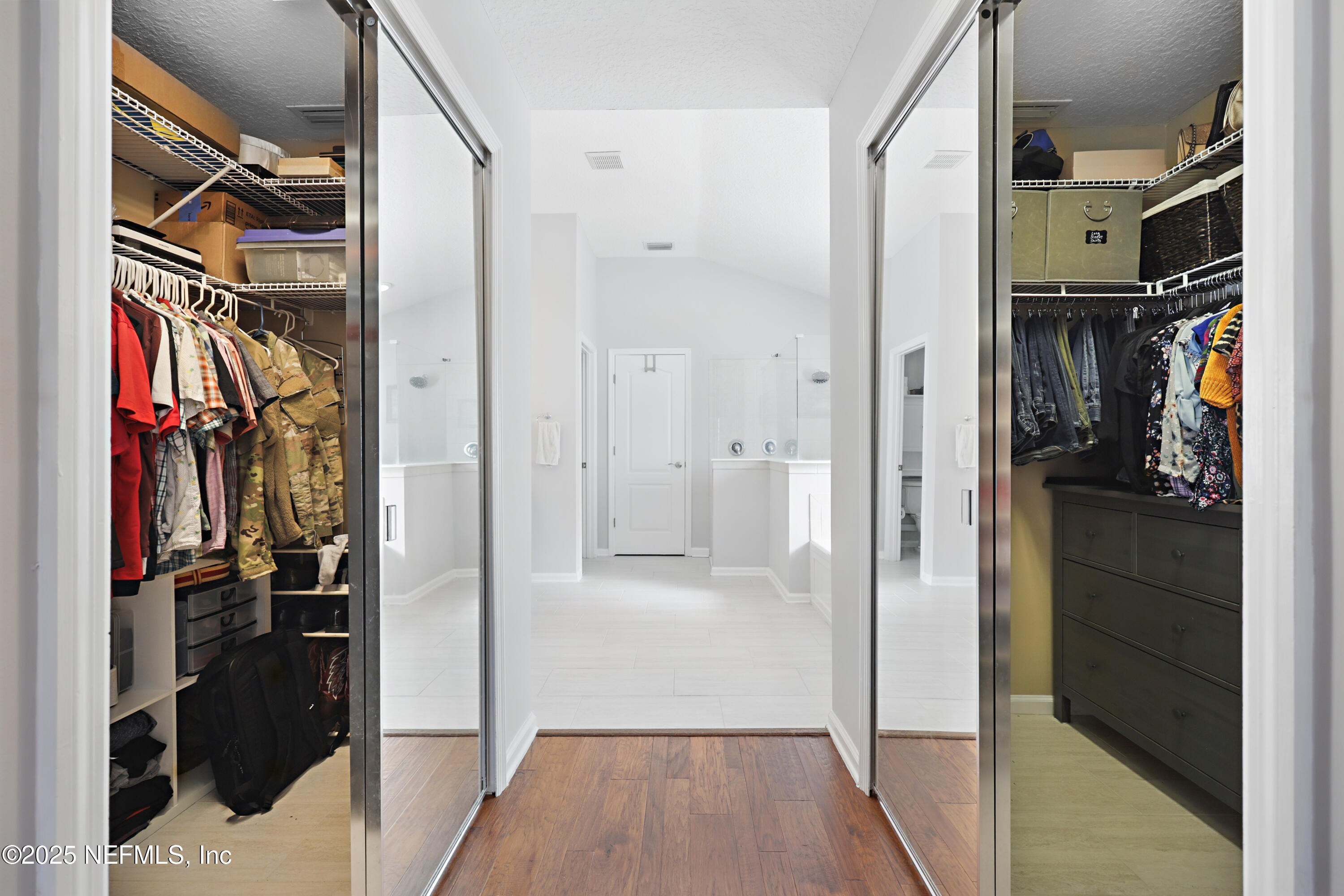 672 Porta Rosa Circle St. Augustine, FL 32092 - Photo 20 of 42 a view of walk in closet with clothes and shoes