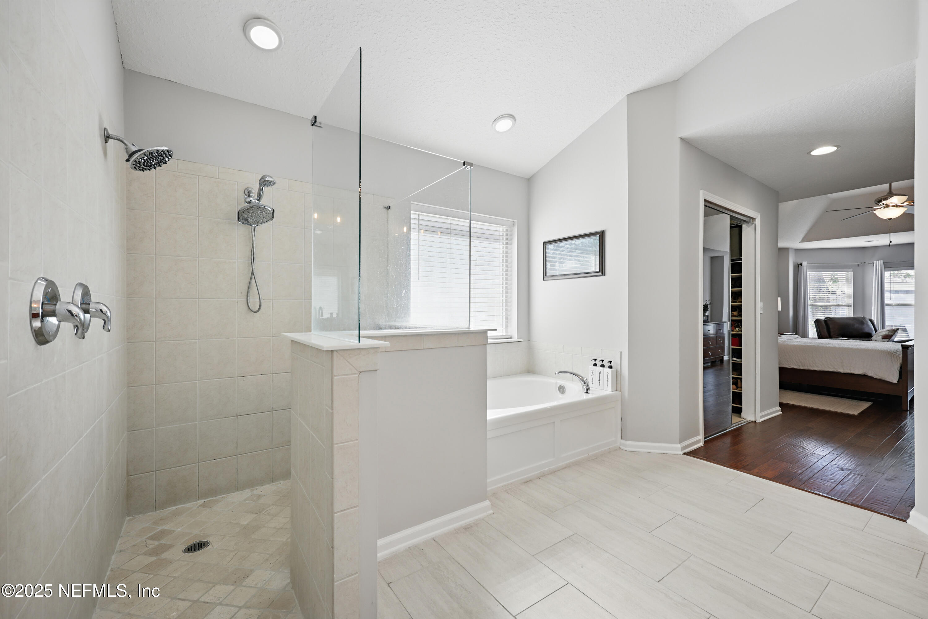 672 Porta Rosa Circle St. Augustine, FL 32092 - Photo 22 of 42 a bathroom with a bathtub and a shower