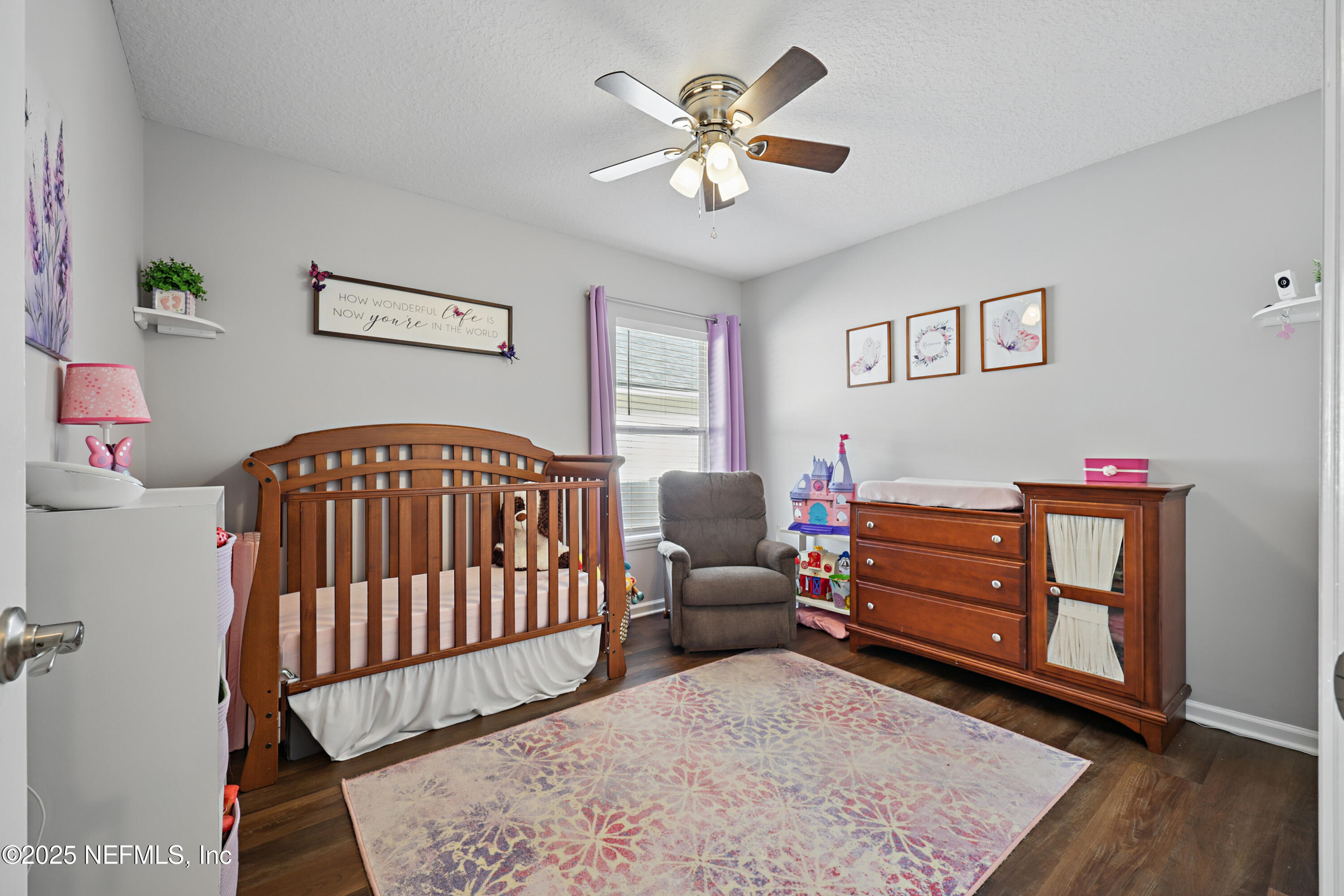 672 Porta Rosa Circle St. Augustine, FL 32092 - Photo 24 of 42 a bedroom with a bed and a baby crib