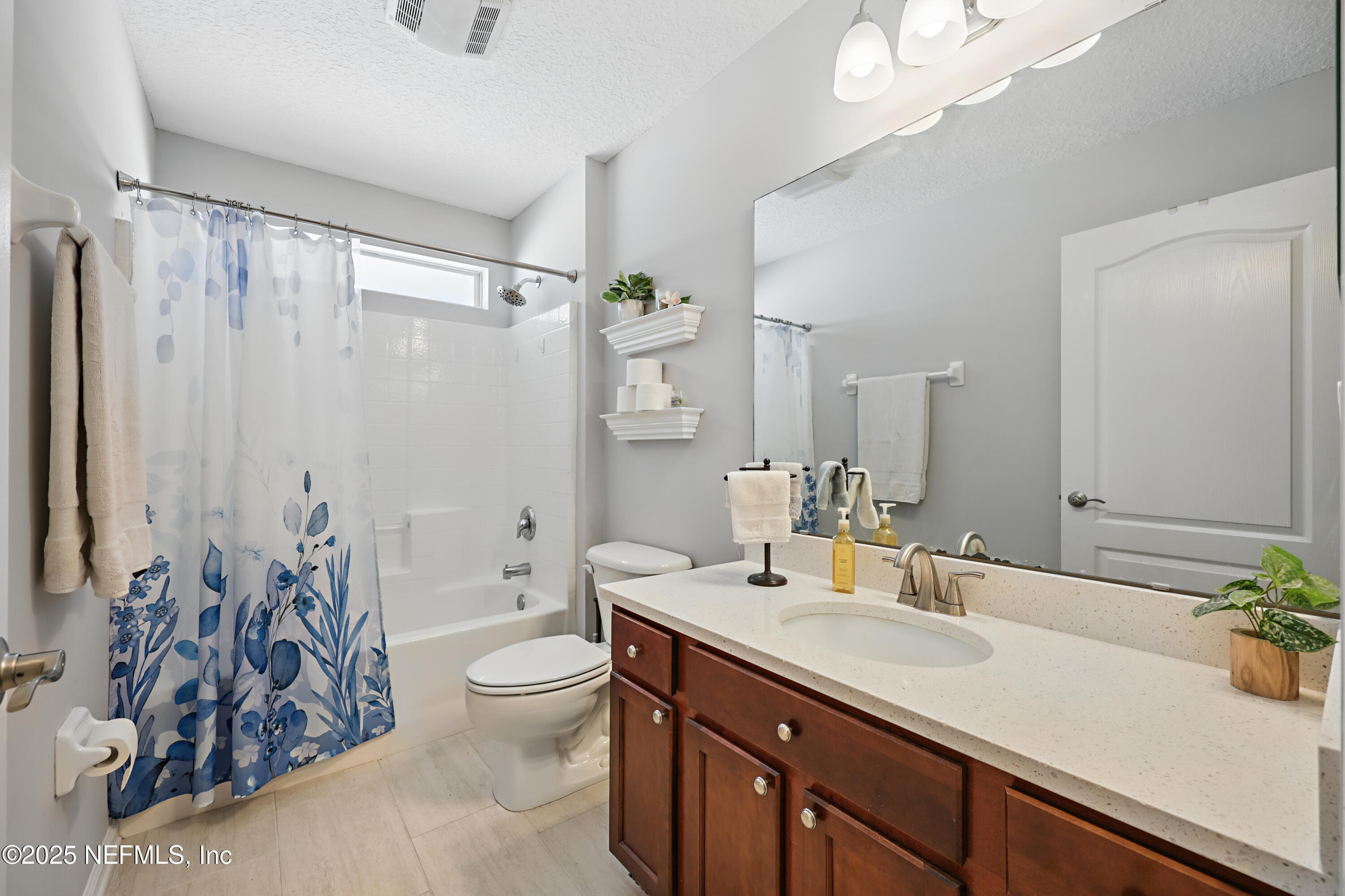 672 Porta Rosa Circle St. Augustine, FL 32092 - Photo 26 of 42 a bathroom with a double vanity sink toilet and shower