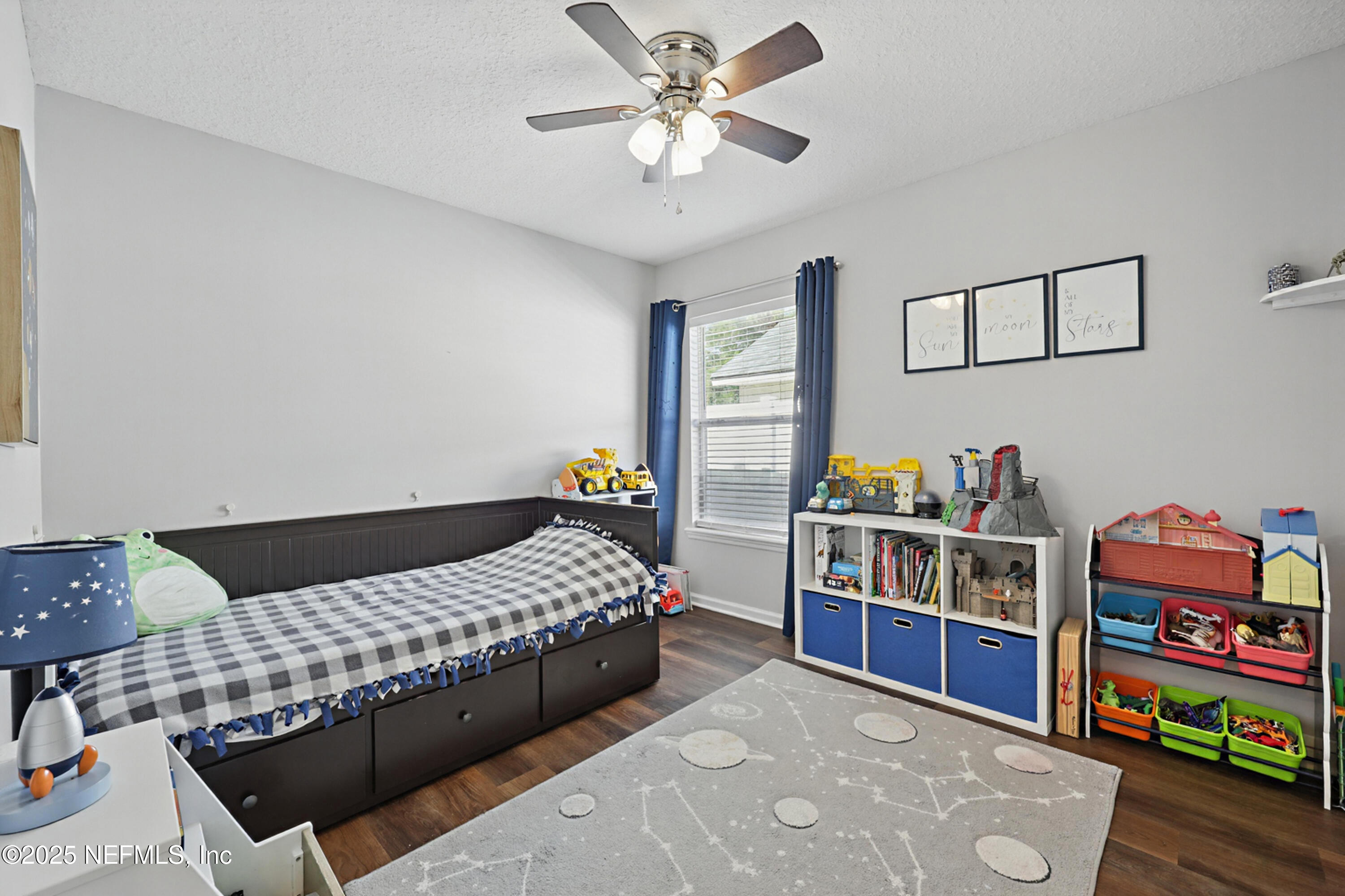 672 Porta Rosa Circle St. Augustine, FL 32092 - Photo 27 of 42 a bedroom with bed and book shelf