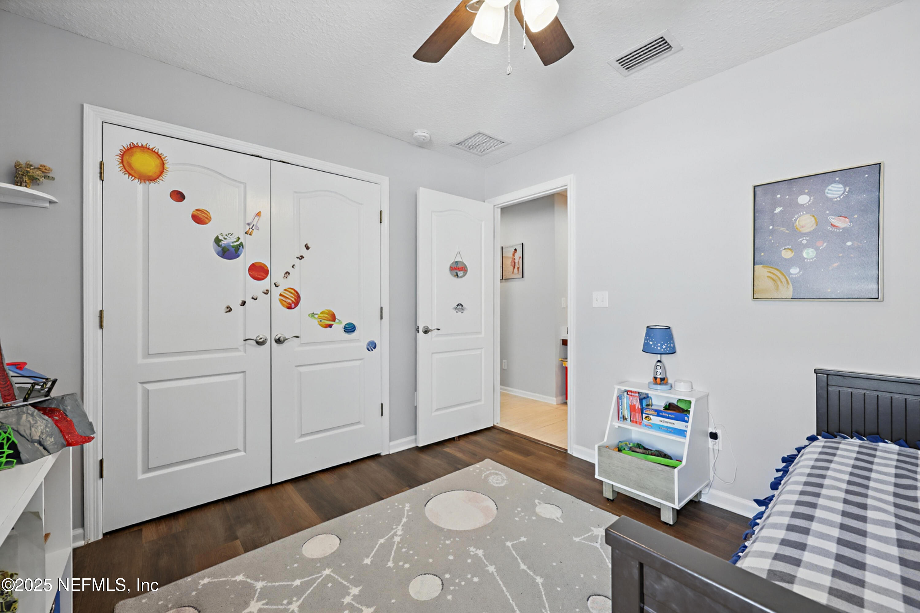 672 Porta Rosa Circle St. Augustine, FL 32092 - Photo 28 of 42 a bedroom with furniture and wooden floor