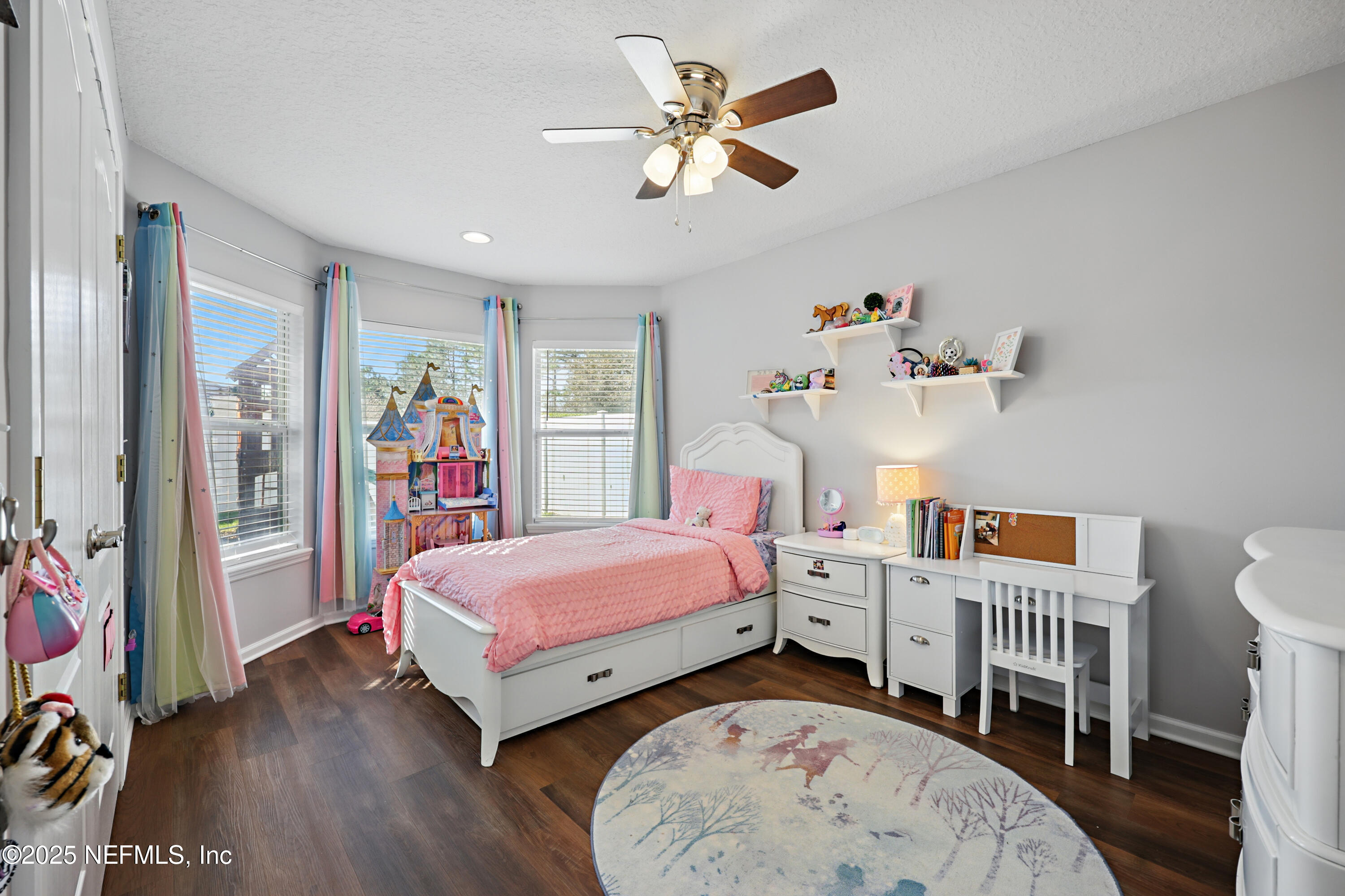 672 Porta Rosa Circle St. Augustine, FL 32092 - Photo 31 of 42 a bedroom with a bed and a chandelier