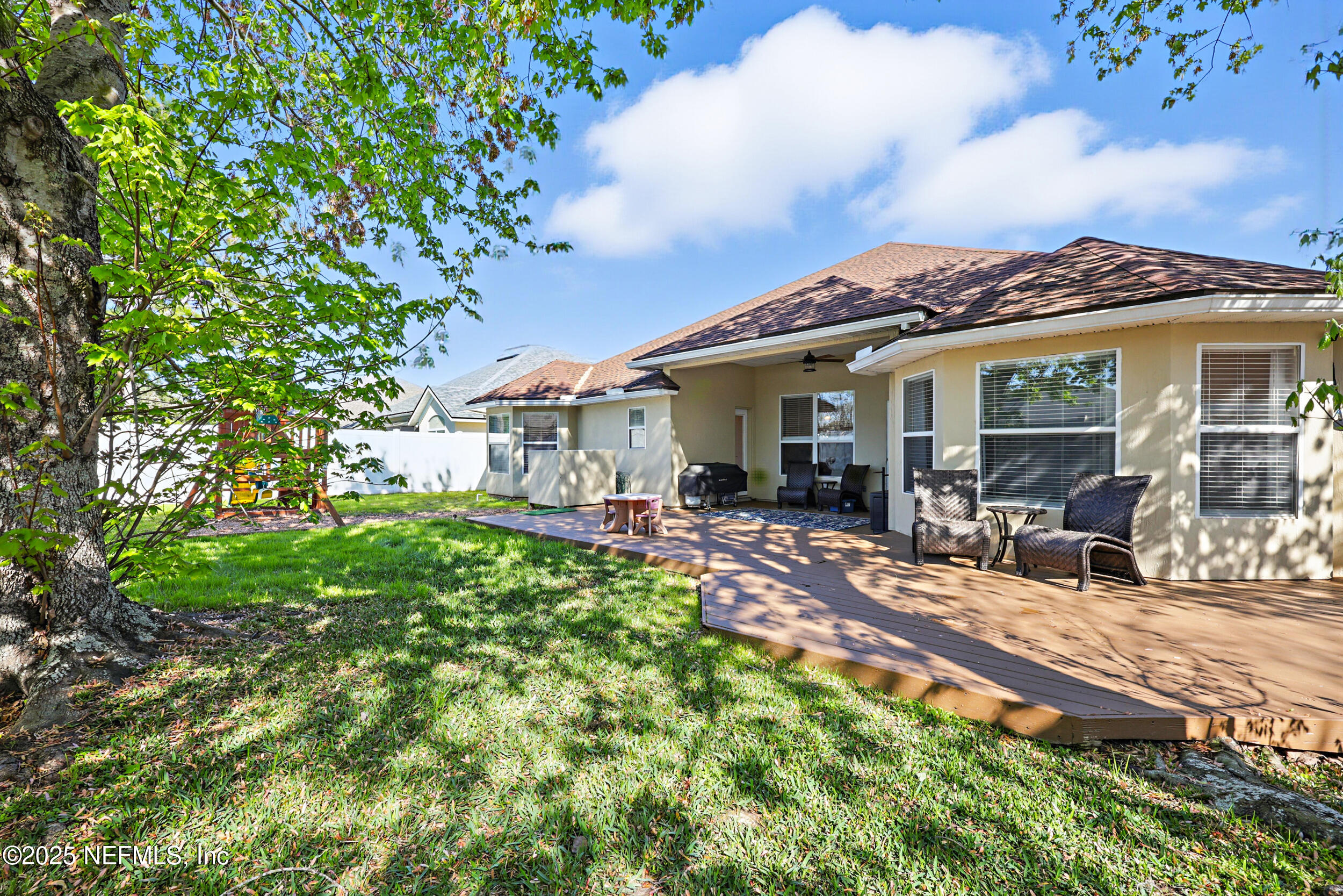 672 Porta Rosa Circle St. Augustine, FL 32092 - Photo 36 of 42 a view of a house with backyard and sitting area