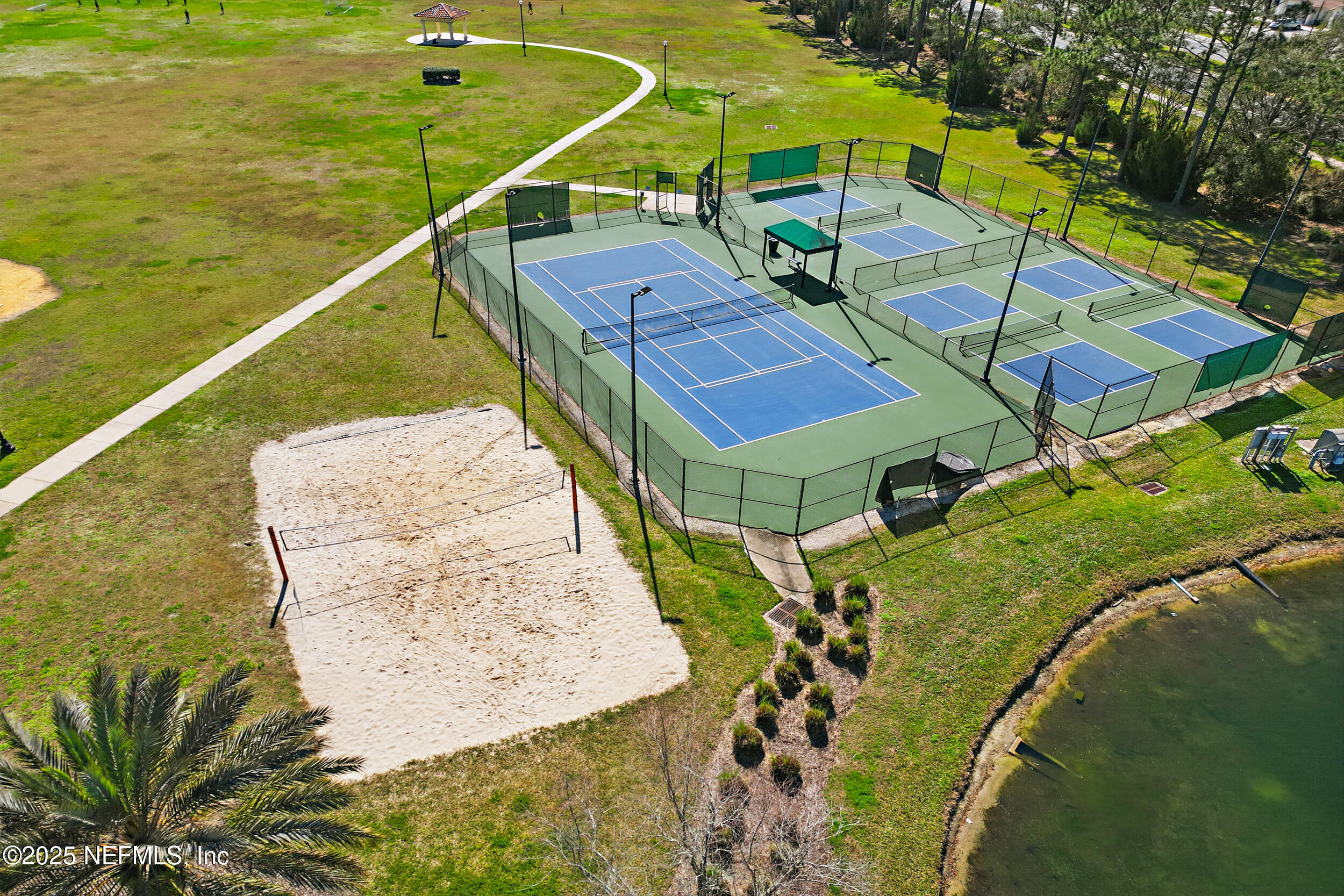 672 Porta Rosa Circle St. Augustine, FL 32092 - Photo 41 of 42 a view of a swimming pool with a patio