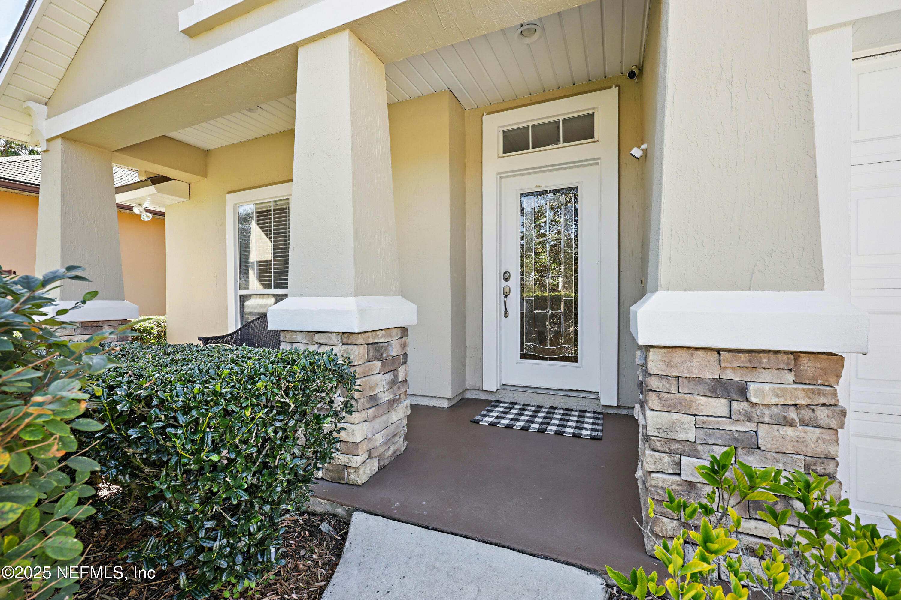 672 Porta Rosa Circle St. Augustine, FL 32092 - Photo 5 of 42 a front view of a house with an outdoor space