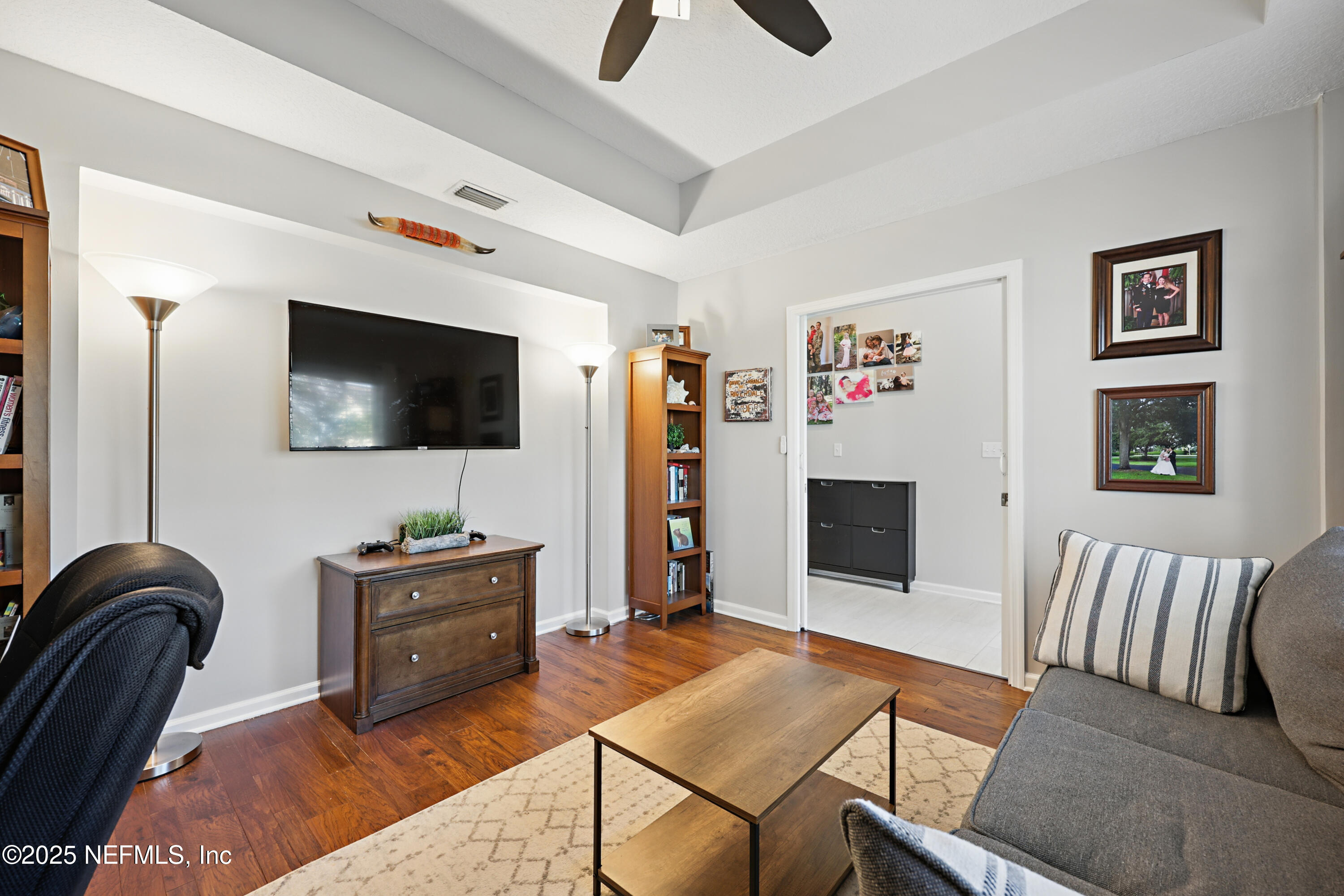 672 Porta Rosa Circle St. Augustine, FL 32092 - Photo 8 of 42 a living room with furniture and a flat screen tv