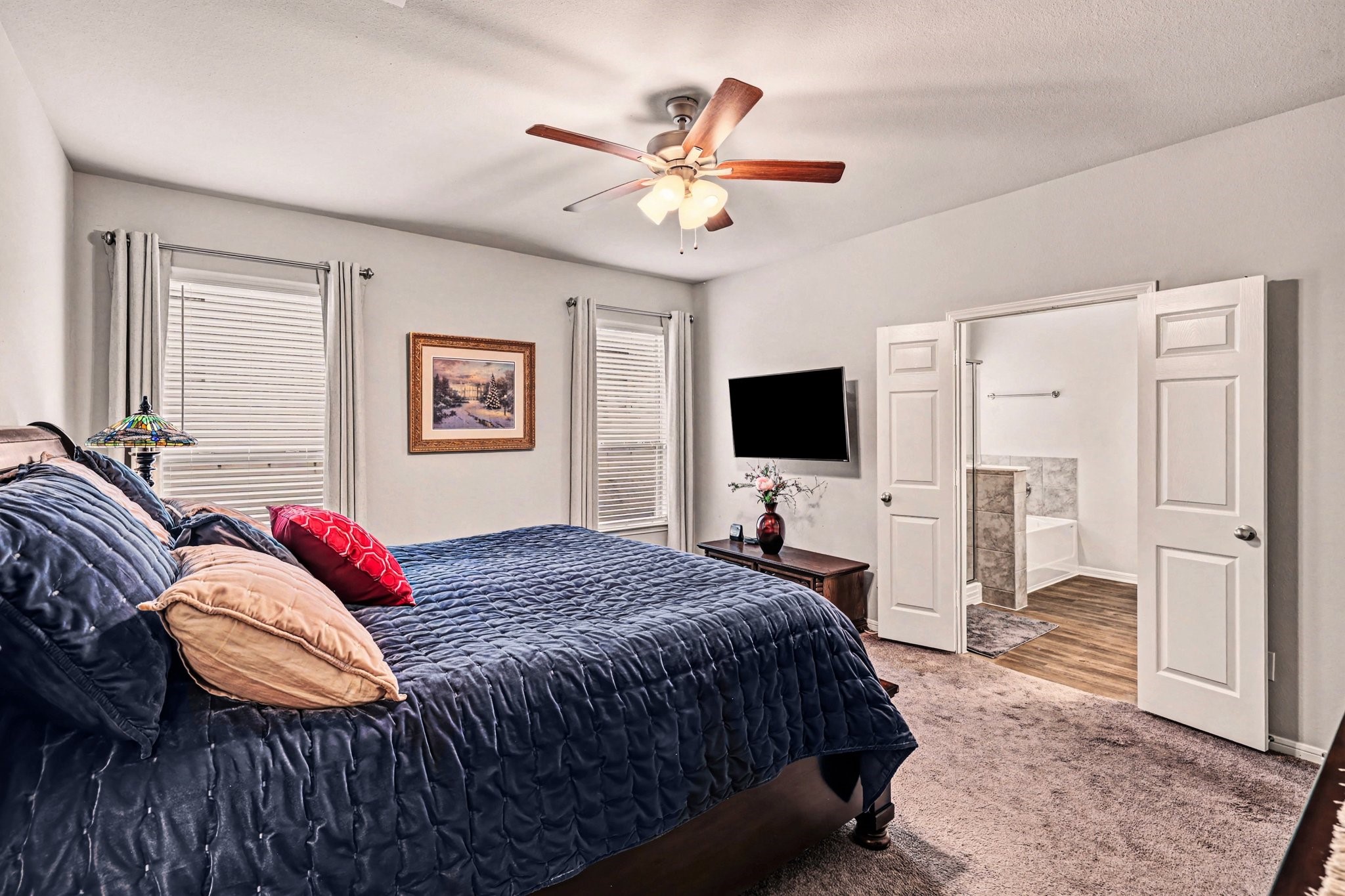 320 Red Maple Lane Conroe, TX 77304 - Photo 11 of 24 Elegant double-door entry leads to a private en-suite bath designed for relaxation.