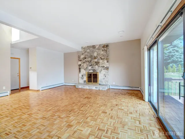 a view of an empty room with windows