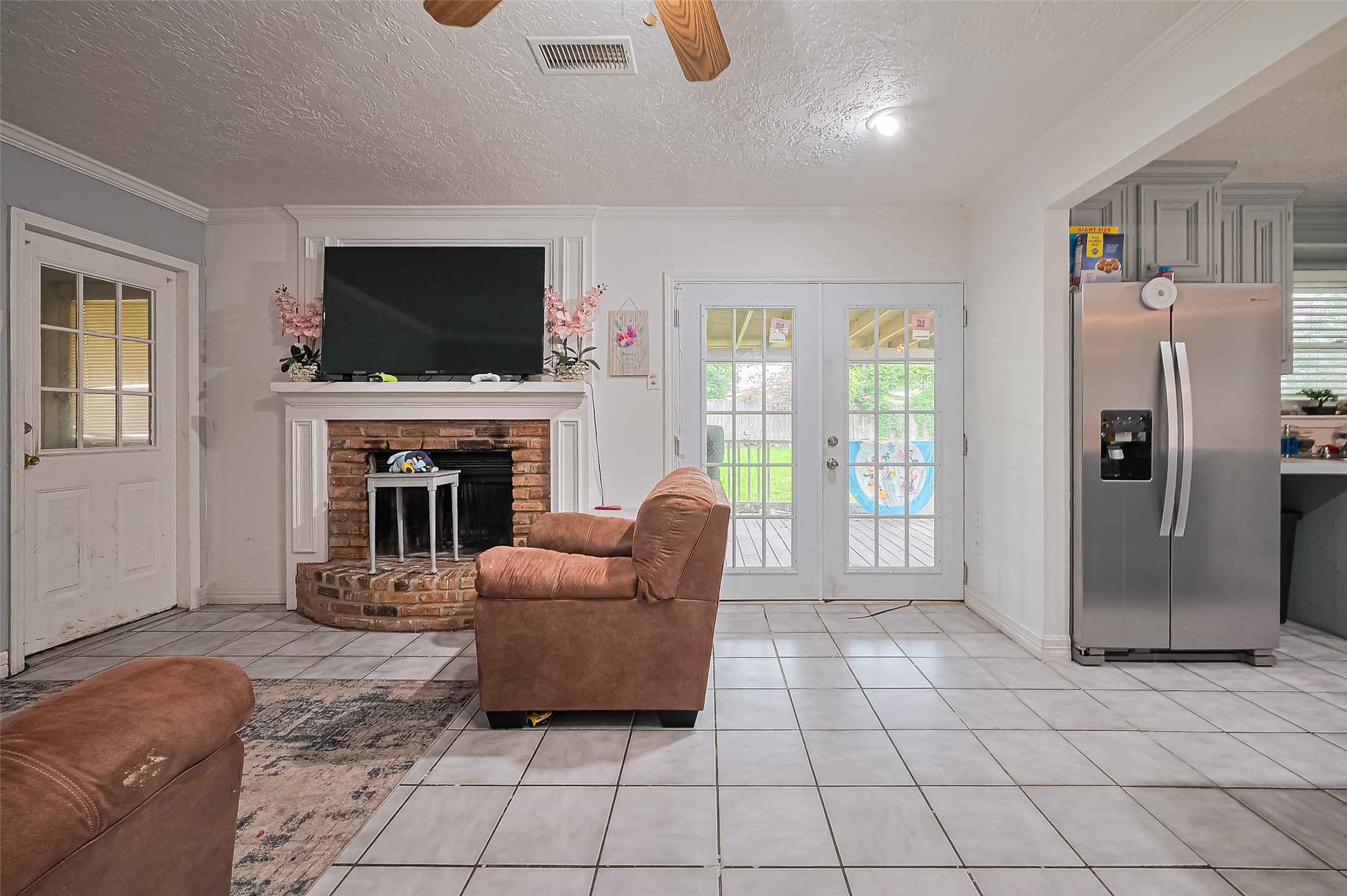 13351 Oak Leaf Lane Houston, TX 77015 - Photo 16 of 27 a living room with furniture a flat screen tv and a fireplace
