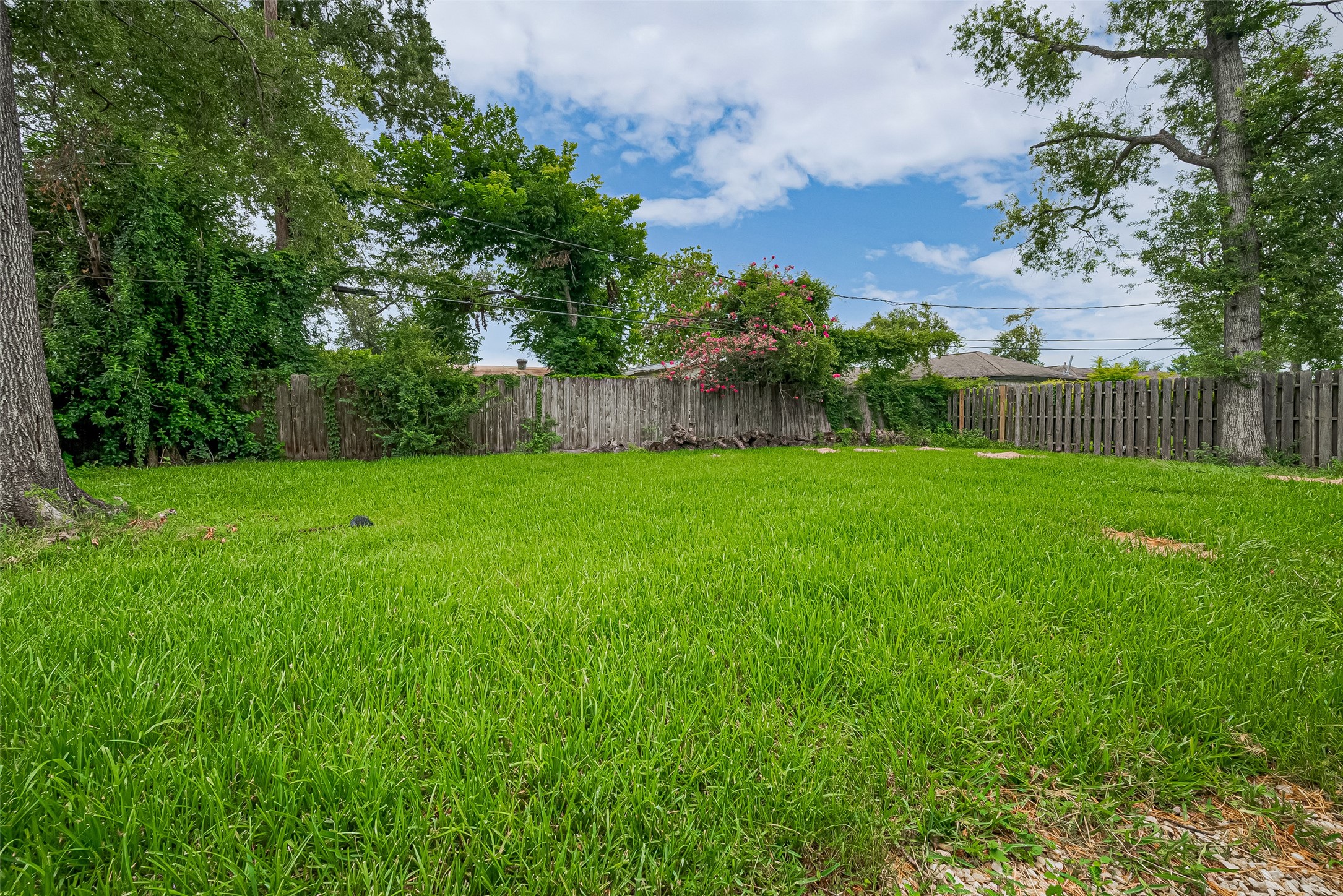 13351 Oak Leaf Lane Houston, TX 77015 - Photo 22 of 27 a view of a garden with a building in the background