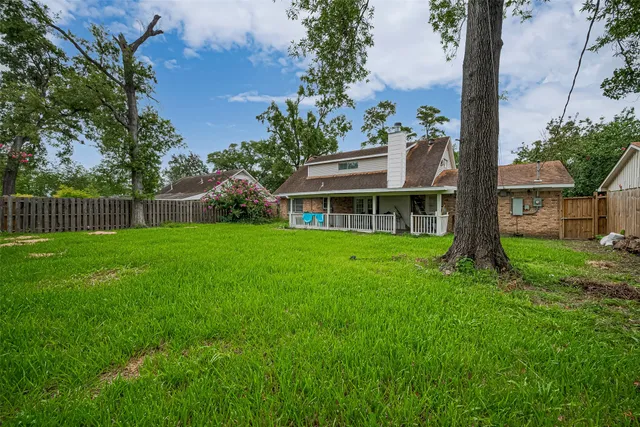 a view of house with a garden