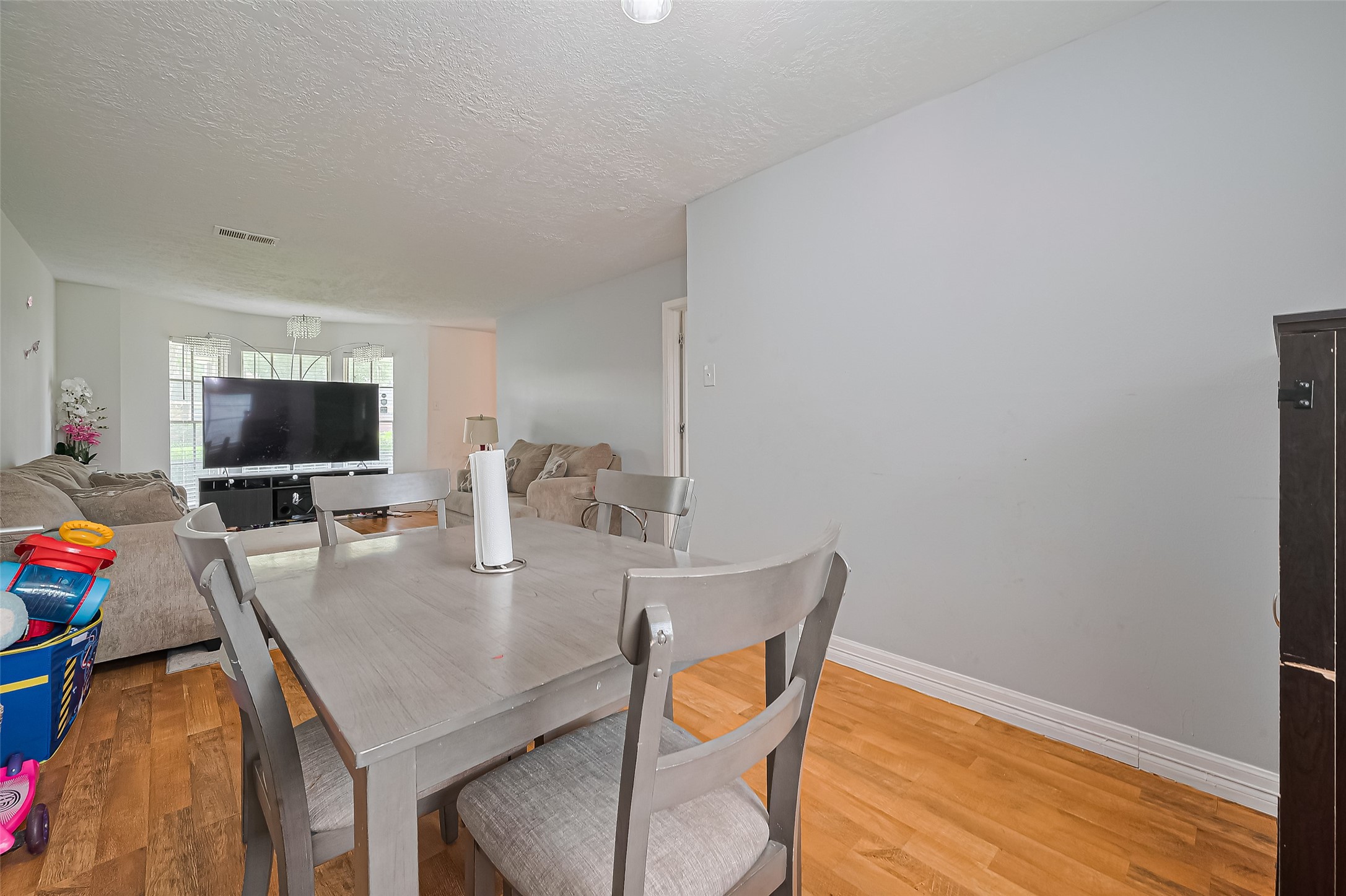 13351 Oak Leaf Lane Houston, TX 77015 - Photo 7 of 27 a dining room with furniture and wooden floor