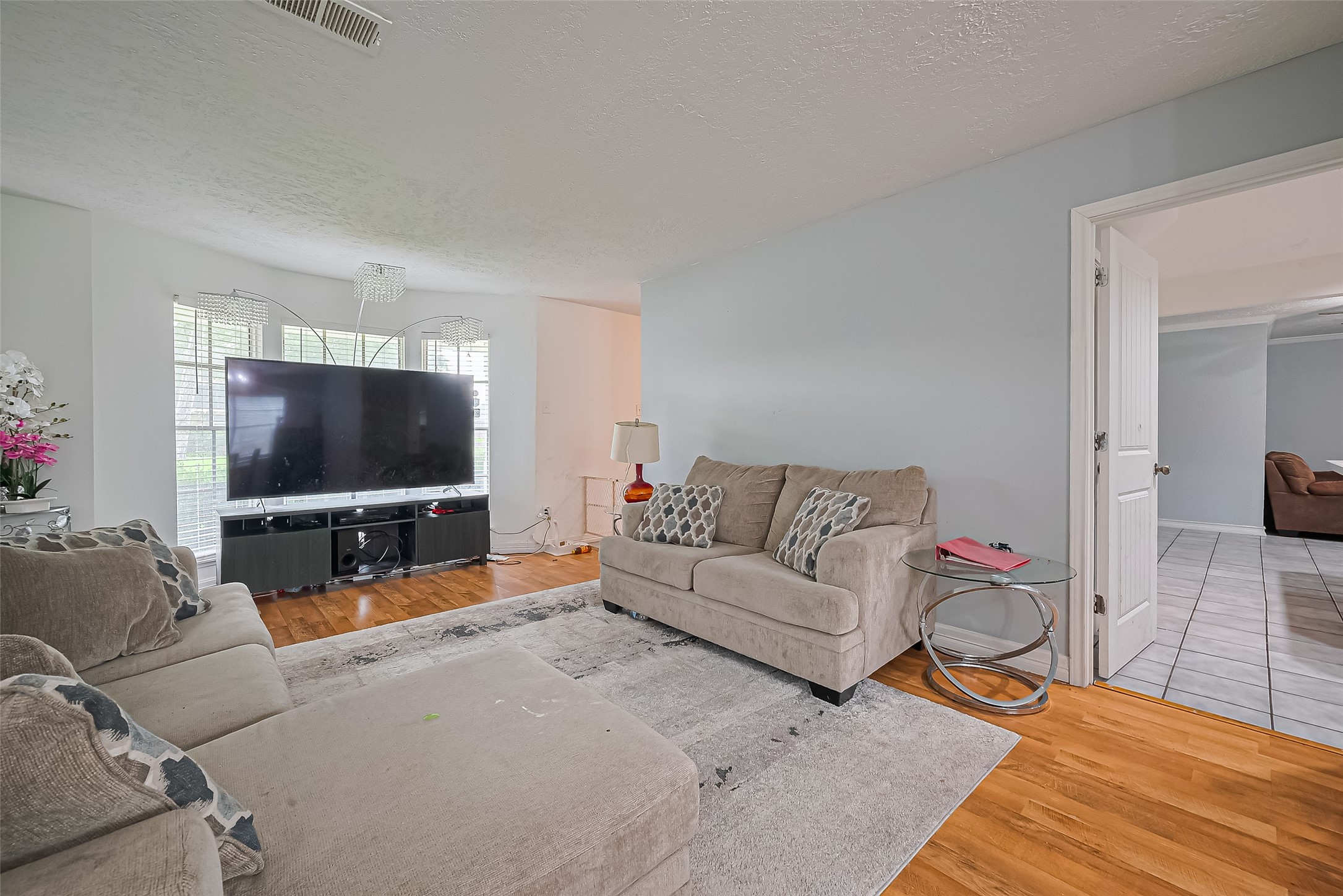 13351 Oak Leaf Lane Houston, TX 77015 - Photo 8 of 27 a living room with furniture and a flat screen tv
