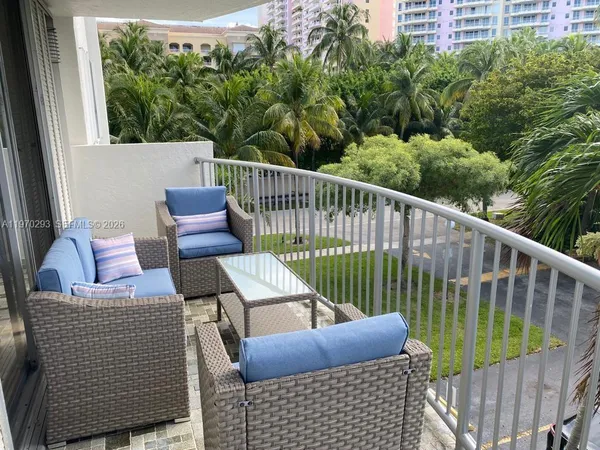 a view of balcony with furniture