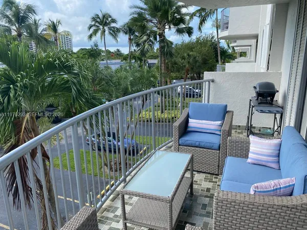 a view of balcony with furniture