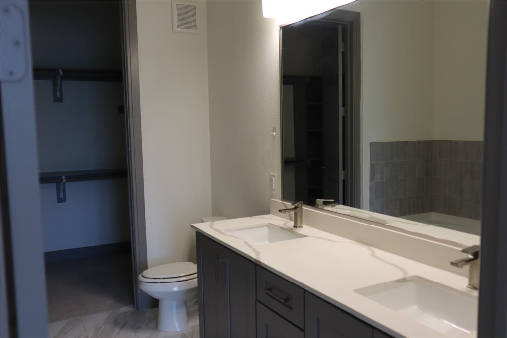 2700 Old Denton Road, Unit 3314 Carrollton, TX 75007 - Photo 3 of 14 a bathroom with a sink and a toilet