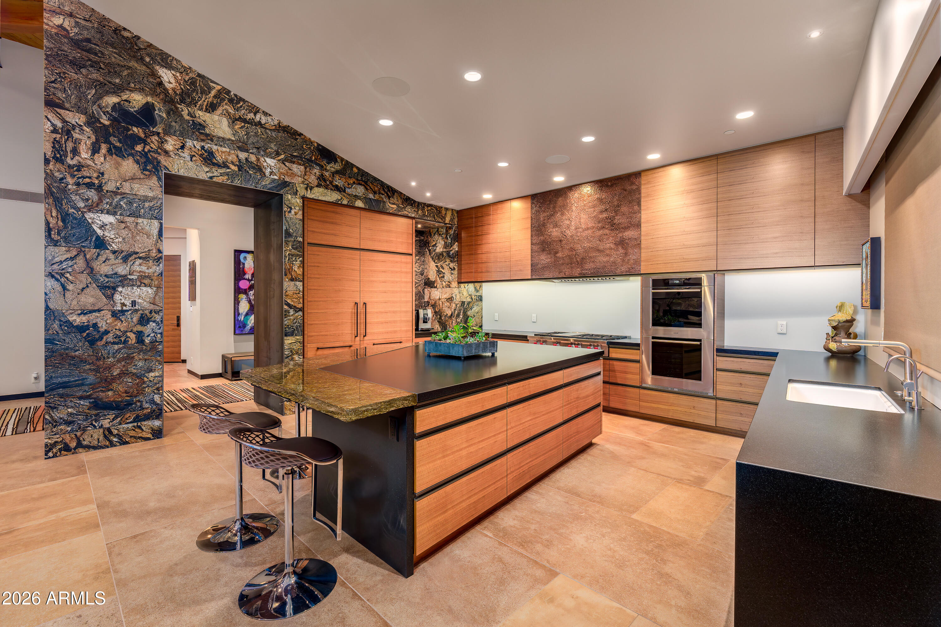 120 Paisano Road Sedona, AZ 86336 - Photo 26 of 52 a kitchen with stainless steel appliances kitchen island granite countertop a sink and cabinets