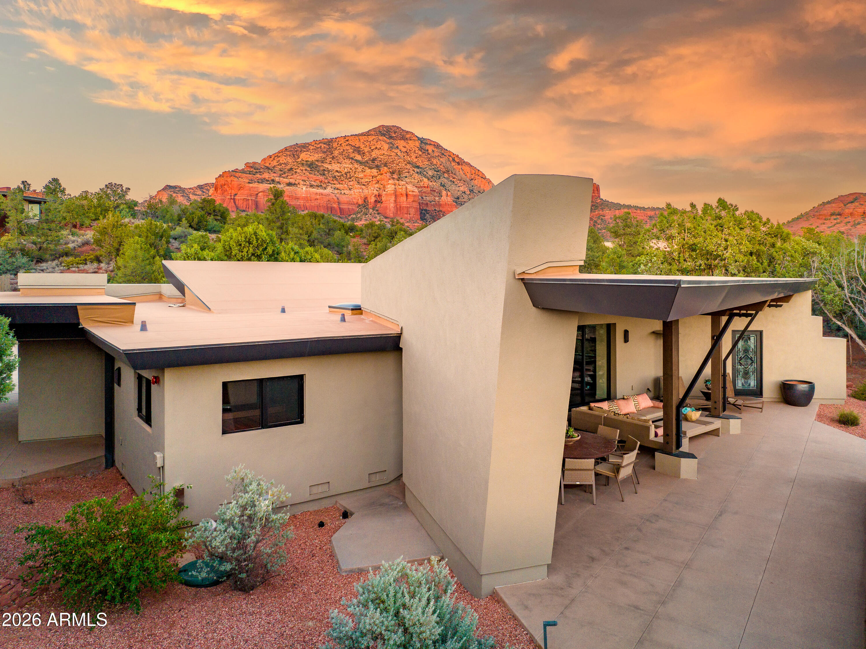 120 Paisano Road Sedona, AZ 86336 - Photo 8 of 52 a view of a terrace with a table and chairs
