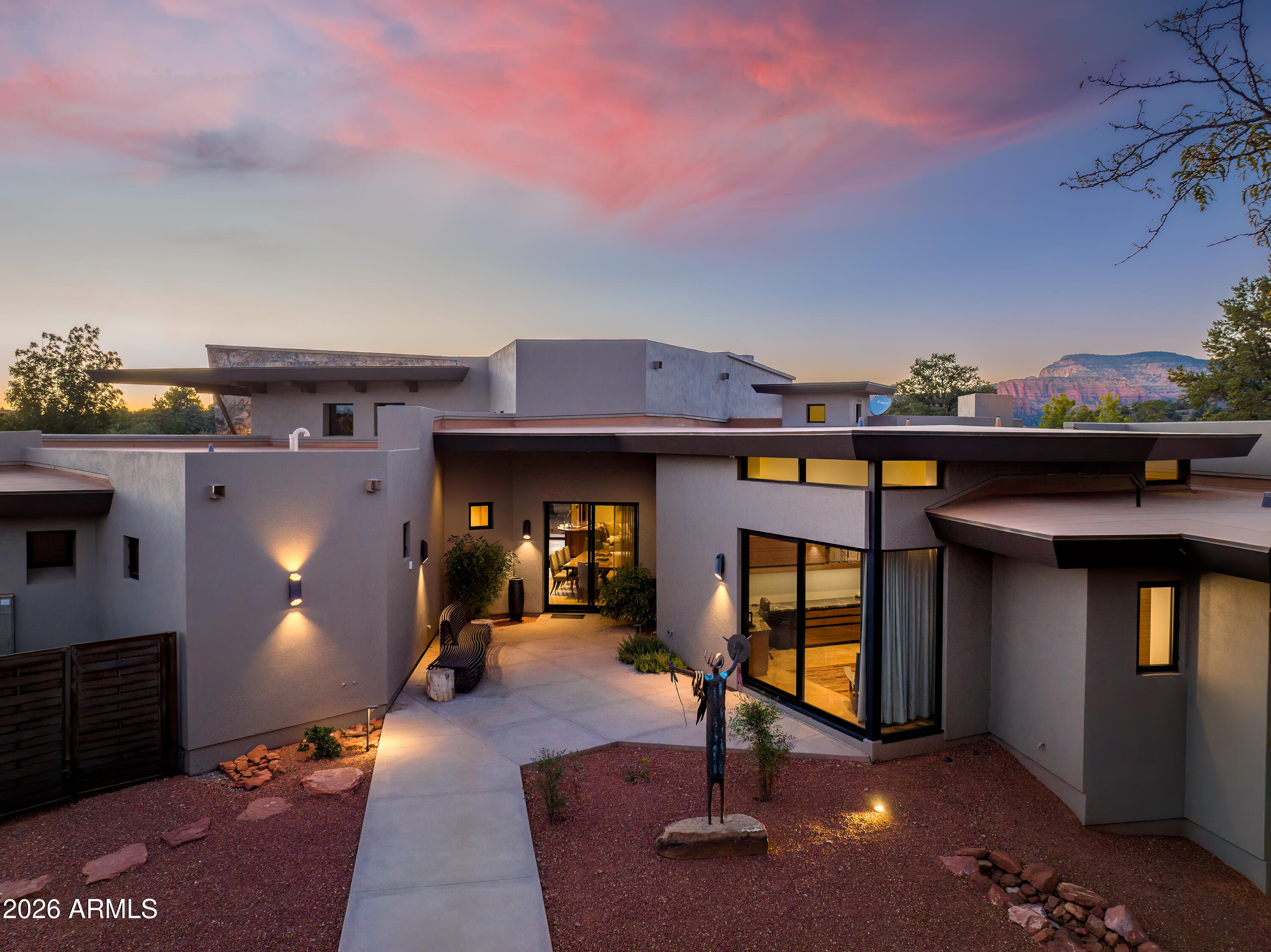 120 Paisano Road Sedona, AZ 86336 - Photo 10 of 52 a view of a house with roof and sitting area