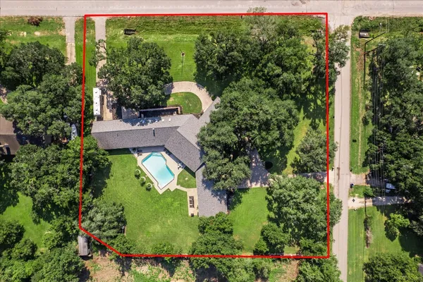 a view of a park with large trees