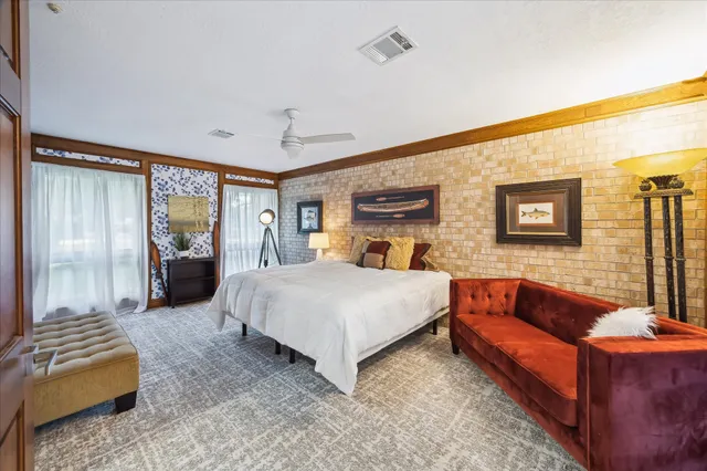 a bed room with furniture and a couch