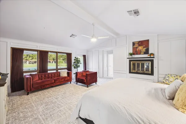 a bedroom with a bed and a couch