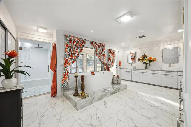 a bedroom with a bed couch and dresser