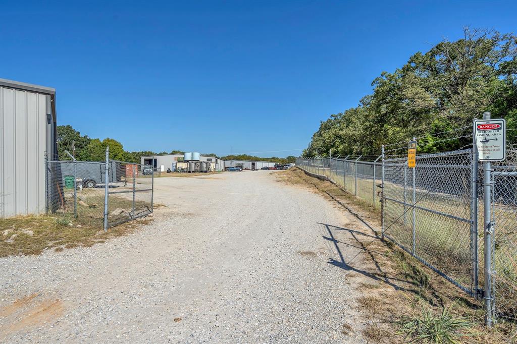 2522 Highway 287 Decatur, TX 76234 - Photo 2 of 25 a view of a dry yard with wooden fence