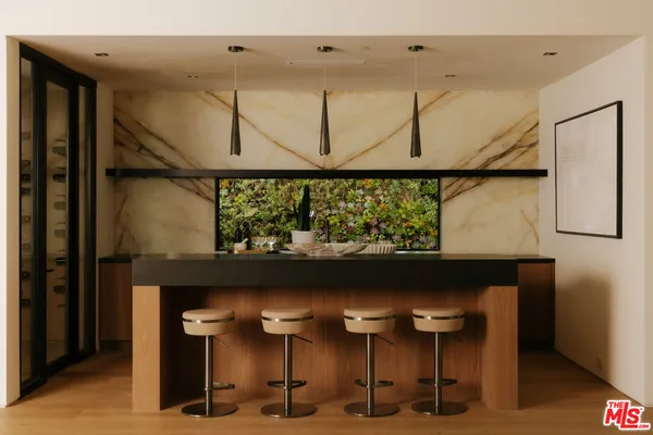 a close view of two chairs and table in a room