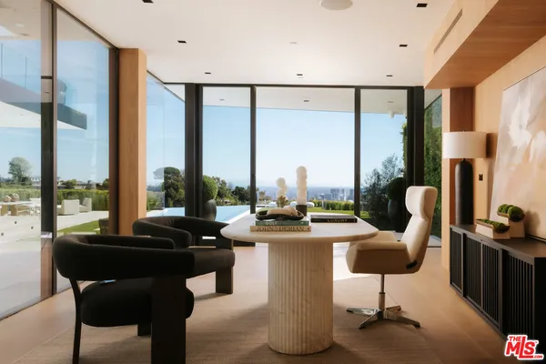 a view of a dining room with furniture window and outside view