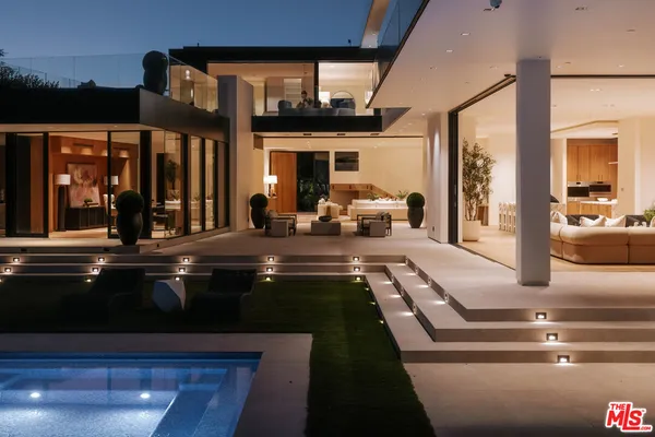 a lobby with furniture and floor to ceiling window