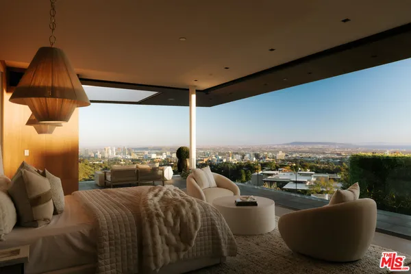 a bed room with a bed and a window