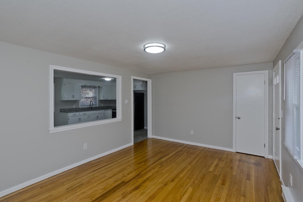 35 Ludlow Road South Hadley, MA 01075 - Photo 11 of 34 a view of an empty room with wooden floor and a window