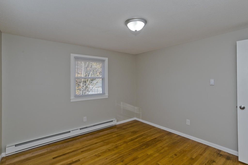 35 Ludlow Road South Hadley, MA 01075 - Photo 20 of 34 a view of an empty room with wooden floor and a window