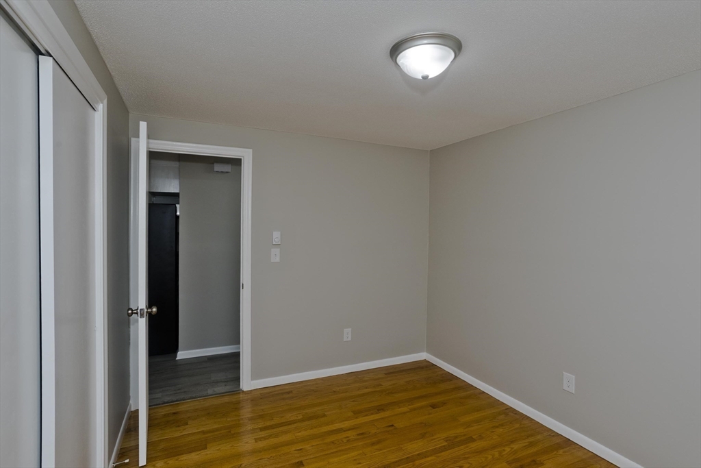 35 Ludlow Road South Hadley, MA 01075 - Photo 28 of 34 an empty room with wooden floor and windows