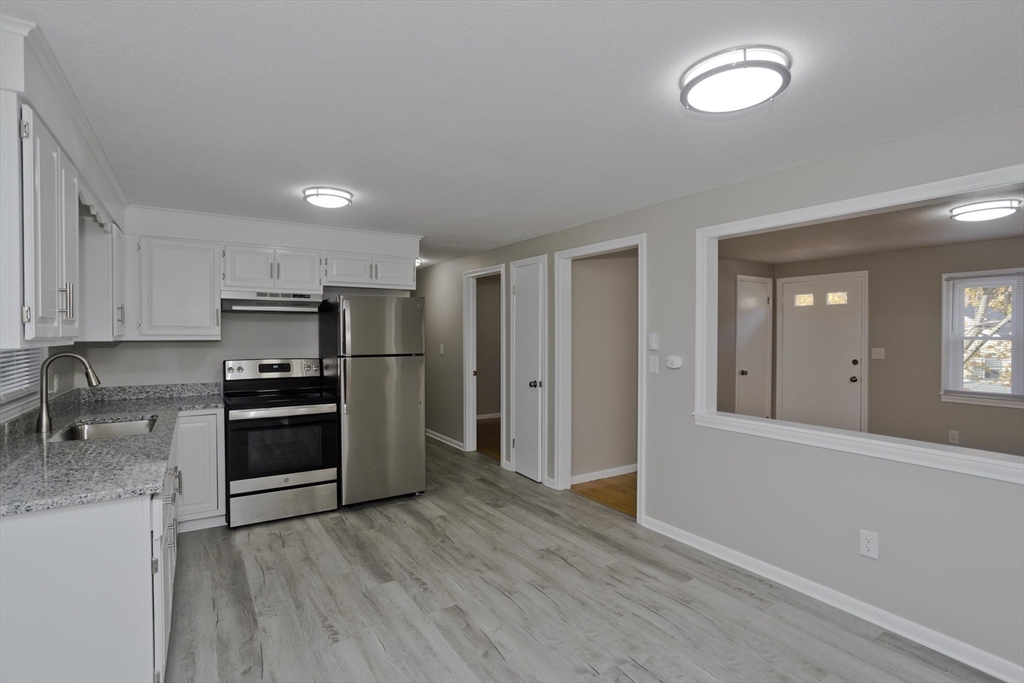 35 Ludlow Road South Hadley, MA 01075 - Photo 7 of 34 a kitchen with stainless steel appliances granite countertop a refrigerator and a stove top oven