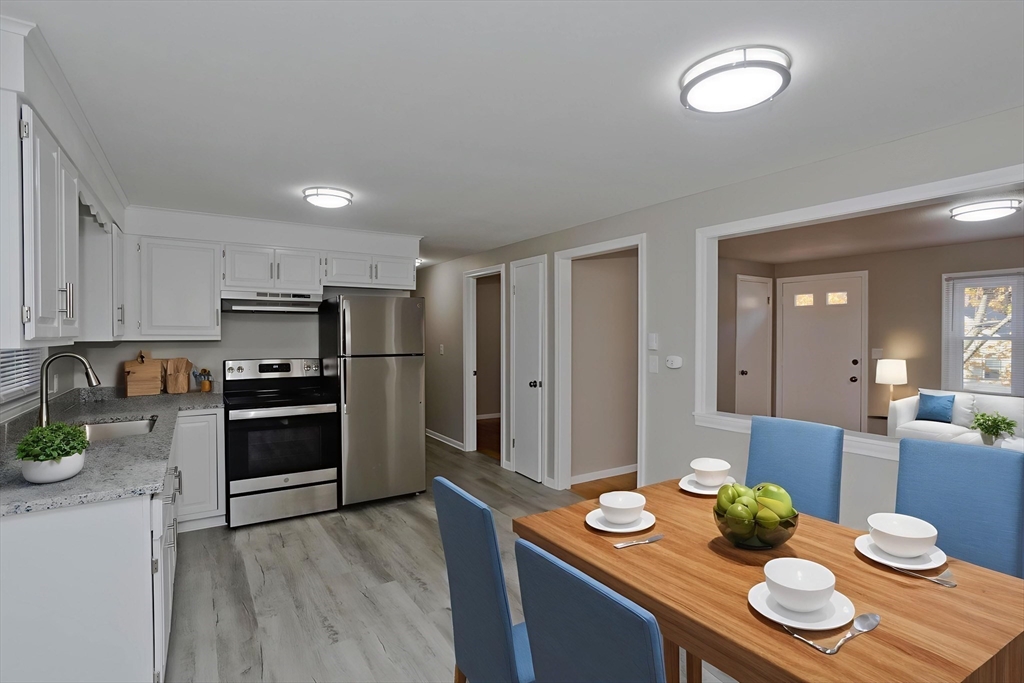 35 Ludlow Road South Hadley, MA 01075 - Photo 8 of 34 a kitchen with stainless steel appliances granite countertop a stove refrigerator and dining table