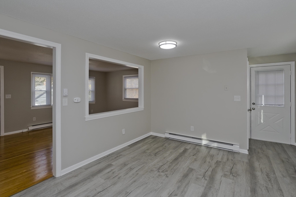 35 Ludlow Road South Hadley, MA 01075 - Photo 9 of 34 a view of an empty room with wooden floor and a window